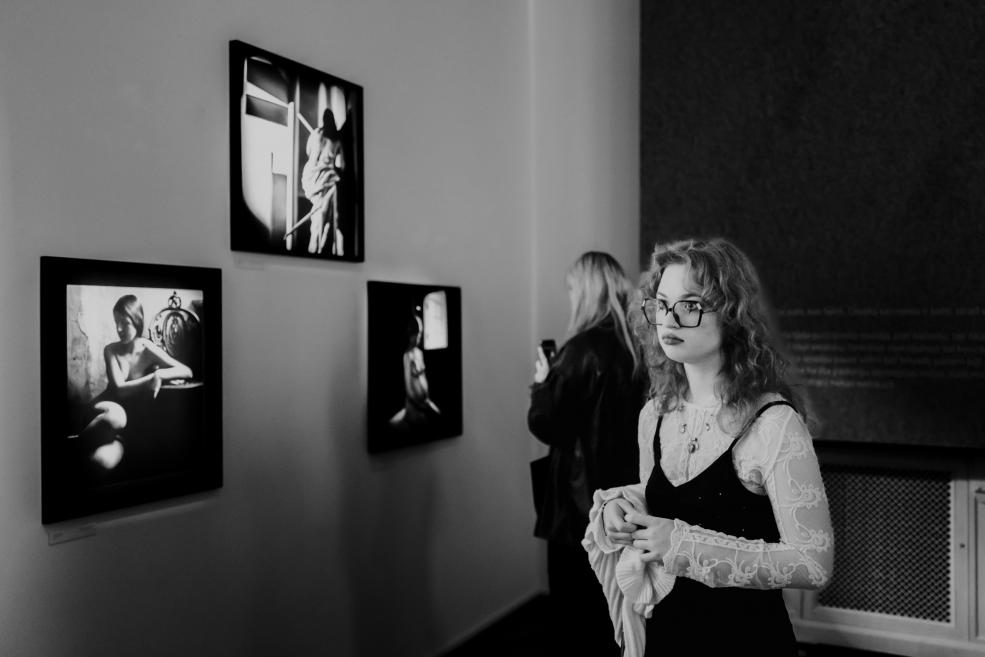 Black and white image with visitors at the opening of the exhibition.