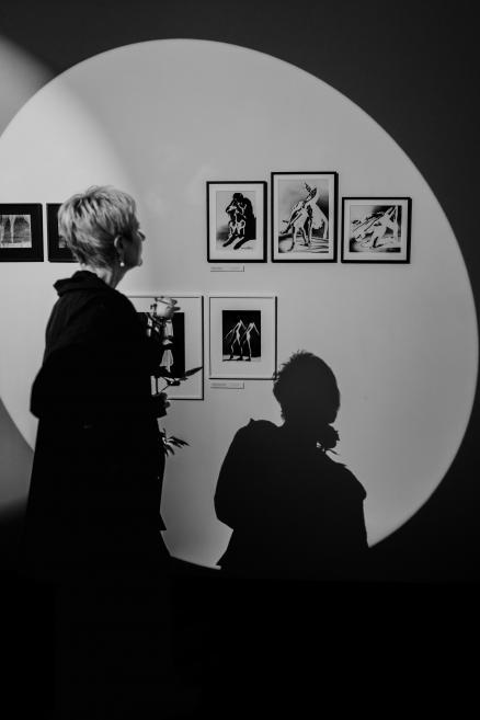 Black and white image with visitors at the opening of the exhibition.