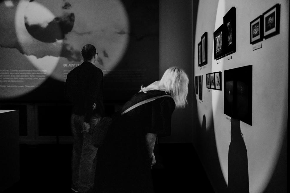 Black and white image with visitors at the opening of the exhibition.